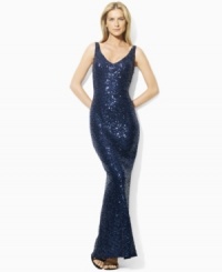 Exuding bold, elegant appeal, Lauren by Ralph Lauren's floor-length dress is tailored with a sequined mesh overlay and a sexy V-neckline at the front and back for a sleek, feminine look. Exuding bold, elegant appeal, Lauren by Ralph Lauren's floor-length dress is tailored with a sequined mesh overlay and a sexy V-neckline at the front and back for a sleek, feminine look.