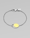 From the Eclipse Collection. A modern update of the classic ID bracelet, offering a slanted oval disk on a graceful chain.Sterling silverGoldplatedLength, about 7Disc length, about ¾Lobster claspImported