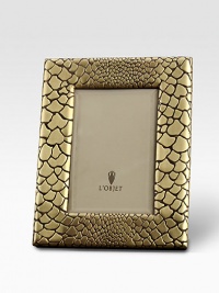 A meticulously handcrafted, goldplated frame with a stretched leather back. From the Python Collection GoldplateImportedDIMENSION INFORMATION4 X 6 (6 X 8 overall)5 X 7 (7 X 9 overall) A meticulously handcrafted, goldplated frame with a stretched leather back. From the Python Collection GoldplateImportedDIMENSION INFORMATION4 X 6 (6 X 8 overall)5 X 7 (7 X 9 overall)