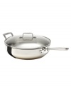 The cornerstone of your successful kitchen, Emeril's sauté pan brings versatility to your range with a heavy-gauge stainless steel construction, high sides and a flared lip for drip-free pouring. The ideal companion for frying and searing, this pan features a tempered glass domed lid that traps in flavors and moisture. Lifetime warranty. (Clearance)