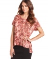 In an abstract python-print, this Kensie top adds a splash of style to your look with it's high-low hem!