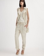 Parka-inspired details dress up this sleeveless zip-front design.Foldover collarAsymmetrical front zipSnap detailsFlap pocketsSide slash pocketsGathered hemlineBack vent with rivet detailsFully linedAbout 32 from shoulder to hem60% viscose/40% polyesterDry cleanImportedModel shown is 5'9 (175cm) wearing US size 4. 
