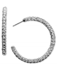 Sparkly crystals add a glamorous edge to classic hoop earrings. Silvertone posts. Diameter measures 1-3/8 at widest point. Sparkly crystals add a glamorous edge to classic hoop earrings. Silvertone posts. Diameter measures 1-3/8 at widest point.