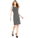 Slate grey lightens up a classic sheath dress from Calvin Klein. Origami-inspired darts at the waist add a fresh, architectural touch.