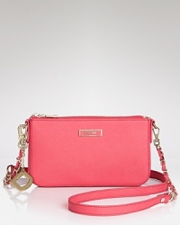 The sized-down shape of this Saffiano-finished DKNY crossbody is an instant update, secured by a zipper that opens to a lined interior, proportioned for the nighttime essentials. The sized-down shape of this Saffiano-finished DKNY crossbody is an instant update, secured by a zipper that opens to a lined interior, proportioned for the nighttime essentials.