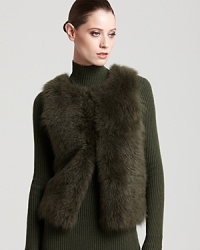 Plush fur lends exotic edge to a Rachel Roy vest, finished with a ribbed knit back for a modern mixed-media silhouette. Plush fur lends exotic edge to a Rachel Roy vest, finished with a ribbed knit back for a modern mixed-media silhouette.