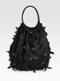 A sweet design with pretty bows allover a lace-covered satin style.Double patent leather shoulder straps, 8 dropOpen topTwo outside zip pocketsCotton lining12W X 15H X 7DMade in Italy A sweet design with pretty bows allover a lace-covered satin style.Double patent leather shoulder straps, 8 dropOpen topTwo outside zip pocketsCotton lining12W X 15H X 7DMade in Italy