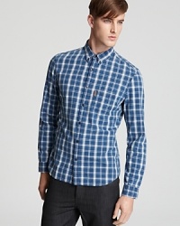 A traditional plaid pattern is rendered in soft cotton for a comfortable feel against the skin. Tailored for a slim, modern fit, this button-down gives you a reliably handsome, everyday option. A traditional plaid pattern is rendered in soft cotton for a comfortable feel against the skin. Tailored for a slim, modern fit, this button-down gives you a reliably handsome, everyday option.