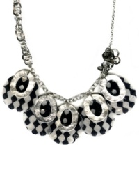 Make ready the raceway. FALCHI by Falchi's black and white print shell necklace adds energy to any look. Asymmetrical design set in silver tone mixed metal. Approximate length: 22 inches. Approximate drop: 2 inches. Make ready the raceway. FALCHI by Falchi's black and white print shell necklace adds energy to any look. Asymmetrical design set in silver tone mixed metal. Approximate length: 22 inches. Approximate drop: 2 inches.