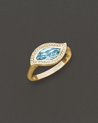 Pavé diamonds frame a faceted blue topaz, set in a 18K gold leaf. By Carelle. Pavé diamonds frame a faceted blue topaz, set in a 18K gold leaf. By Carelle.