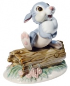Bambi's pal, Thumper, lifts a foot to perform his signature thump-on-a-log move in this handcrafted porcelain figurine from Nao by Lladro.