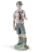 Lladro salutes the Boy Scouts of America with this collectible figurine honoring the program's 100th anniversary. Crafted in fine porcelain with the traditional Scouts uniform and universal emblem, it's a meaningful keepsake for boys of all ages.