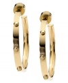 Bring some edge to a timeless look. Michael Kors added stud detail to a classic metal hoop earring. Crafted in gold tone mixed metal. Approximate diameter: 1 inches.