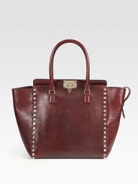 Ultra-luxe Vitello Palmetto leather combines with metal studs to add instantly cool style to this roomy carryall. Double top handles, 5½ dropTurn-lock closureProtective metal feetOne inside zip pocketTwo inside open pocketsCotton lining15½W X 11H X 4DMade in Italy Ultra-luxe Vitello Palmetto leather combines with metal studs to add instantly cool style to this roomy carryall. Double top handles, 5½ dropTurn-lock closureProtective metal feetOne inside zip pocketTwo inside open pocketsCotton lining15½W X 11H X 4DMade in Italy