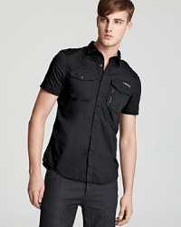 With rugged appeal, this smart button-down offers a reliable casual cool option for low-key parties and hang-outs with friends. With rugged appeal, this smart button-down offers a reliable casual cool option for low-key parties and hang-outs with friends.
