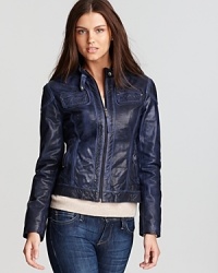 This biker-chic KORS Michael KORS leather jacket is embellished with tonal stitching and shiny zips throughout to emphasize its moto-cross inspiration.