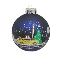 A snowy holiday scene, against a backdrop of the NYC skyline, is depicted on this glass ball ornament from Kurt Adler. A snowy holiday scene, against a backdrop of the NYC skyline, is depicted on this glass ball ornament from Kurt Adler.