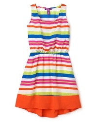 Her summer dress gets a makeover in wild neon stripes and bold colorblock. Her summer dress gets a makeover in wild neon stripes and bold colorblock.