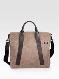 Sturdy and sleek in durable, water-resistant waxed wool, detailed with leather trim and custom die-cast black hardware.Handle and adjustable shoulder strapFlap and zipper closuresOrganizing pocketsInterior zipper pocketCotton liningWaxed wool exterior10¼ X 13½ X 4Imported Sturdy and sleek in durable, water-resistant waxed wool, detailed with leather trim and custom die-cast black hardware.Handle and adjustable shoulder strapFlap and zipper closuresOrganizing pocketsInterior zipper pocketCotton liningWaxed wool exterior10¼ X 13½ X 4Imported