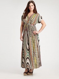 A spellbinding maxi dress featuring a vivacious print. The impeccably designed neckline will complement your decolletage as its Empire waist defines your shape.V-necklineShort sleevesEmpire waistAllover printConcealed back zipper About 43 from natural hem94% venezia/6% spandexDry cleanMade in USA A spellbinding maxi dress featuring a vivacious print. The impeccably designed neckline will complement your decolletage as its Empire waist defines your shape.V-necklineShort sleevesEmpire waistAllover printConcealed back zipper About 43 from natural hem94% venezia/6% spandexDry cleanMade in USA