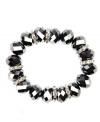 Stunning with silver tone and crystal plastic beads, Nine West's stretch bracelet also boasts silver tone rondelles with clear crystal accents. Bracelet stretches to fit wrist. Crafted in imitation rhodium-plated mixed metal. Approximate diameter: 2 inches.