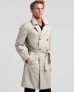 A true classic, the double breasted trench coat with wide, notched collar, double breasted front and belted waist.