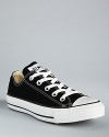 Converse low-top canvas sneakers have old-school charm. Comfortable classic lace-up style and rubber-covered toe.