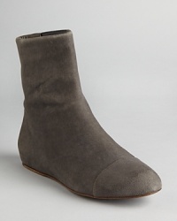 Streamlined stretch and sensual suede define these See by Chloé flat booties. Streamlined stretch and sensual suede define these See by Chloé flat booties.