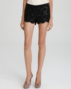 Echo vintage-inspired decadence in a modern silhouette with these Basix sequin shorts, touting a demure scalloped hem.