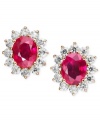 Add some sizzle with red-hot studs. Earrings feature a royalty-inspired design with oval-cut rubies (4-3/8 ct. t.w.) surrounded by sparkling round-cut IGI Certified diamonds (1-9/10 ct. t.w.). Crafted in 14k gold. Approximate diameter: 1/2 inch.