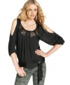 DKNY Jeans' top is a little bit boho, a little bit rock and roll. It looks cool with printed jeans in the skinniest fit!
