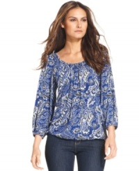 MICHAEL Michael Kors' petite floral-print petite top will put a literal swing in your step! Pair it with slim-fit jeans for a flattering complement. MICHAEL Michael Kors' petite floral-print petite top will put a literal swing in your step! Pair it with slim-fit jeans for a flattering complement.