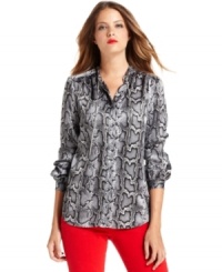 MICHAEL Michael Kors elevates this sleek blouse with a snakeskin print and a shimmering chain threaded through the collar. MICHAEL Michael Kors elevates this sleek blouse with a snakeskin print and a shimmering chain threaded through the collar.
