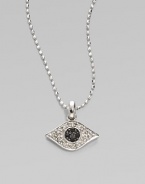 A whimsical evil eye, richly rendered diamonds and blue sapphires, hangs from a 14k white gold chain. Diamonds, 0.1 tcw Sapphires 14k white gold Chain length, about 16 Pendant width, about ½ Claw clasp Imported 