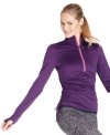 Get active in Ideology's sporty pullover. A breathable fabric blend keeps you cool and dry; ruching at the bodice and smart thumbholes at the sleeves offer a perfect fit.