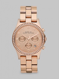 A warm, radiant timepiece with dazzling crystals and a signature dial. Quartz movementWater resistant to 5 ATMRound rose goldtone ion-plated stainless steel case, 40mm (1.6)Crystal bezelRose goldtone chronograph dialLogo markersDate display between 4 and 5 o'clockSecond hand Rose goldtone ion-plated stainless steel link bracelet, 20mm wide (0.8)Imported A warm, radiant timepiece with dazzling crystals and a signature dial. Quartz movementWater resistant to 5 ATMRound rose goldtone ion-plated stainless steel case, 40mm (1.6)Crystal bezelRose goldtone chronograph dialLogo markersDate display between 4 and 5 o'clockSecond hand Rose goldtone ion-plated stainless steel link bracelet, 20mm wide (0.8)Imported