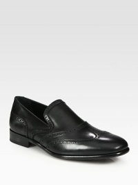 Classic wingtip perforations give these supremely comfortable Italian calfskin slip-ons a dressy edge.Leather liningPadded insoleLeather soleMade in Italy Classic wingtip perforations give these supremely comfortable Italian calfskin slip-ons a dressy edge.Leather liningPadded insoleLeather soleMade in Italy