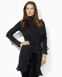 A chic open-knit pointelle cardigan is accented with delicate ruffles for feminine appeal. A chic open-knit pointelle cardigan is accented with delicate ruffles for feminine appeal.
