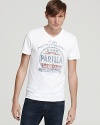 The faded moto graphic print on the front of this slim-fitting V-neck tee recalls an enchanted era of Italian racing.
