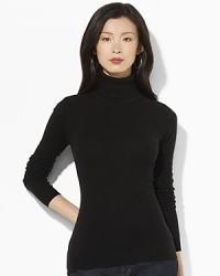 Luxurious silk and cashmere yarns infuse the perennial turtleneck with a note of classic elegance. Luxurious silk and cashmere yarns infuse the perennial turtleneck with a note of classic elegance.