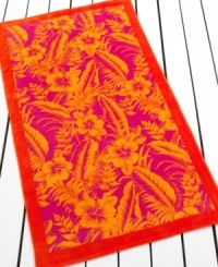 A bold pattern of tropical flowers is framed by a solid border in this beach towel from Lauren Ralph Lauren, featuring a sizzling palette of orange, yellow and pink. A bold pattern of tropical flowers is framed by a solid border in this beach towel from Lauren Ralph Lauren, featuring a sizzling palette of orange, yellow and pink.
