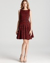 Issa London's fit and flare dress gets set for fall in a thick jacquard knit, showcasing a modern, geometric pattern.