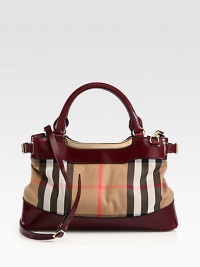 An iconic, check printed canvas design accented with smooth leather trim and radiant hardware.Double leather top handles, 5 dropDetachable adjustable leather shoulder strap, 20½-24 dropMagnetic snap closureProtective metal feetAdjustable side bucklesThree inner compartmentsOne inside zip pocketCotton lining14W X 9H X 4DImported An iconic, check printed canvas design accented with smooth leather trim and radiant hardware.Double leather top handles, 5 dropDetachable adjustable leather shoulder strap, 20½-24 dropMagnetic snap closureProtective metal feetAdjustable side bucklesThree inner compartmentsOne inside zip pocketCotton lining14W X 9H X 4DImported
