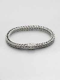 Small sterling silver bracelet in a squared, rope-weave pattern resembling herringbone, with push-lock closure.Sterling silverAbout 3 diam.Imported