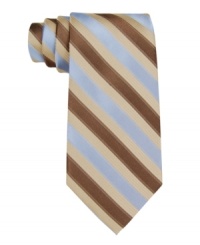 In a traditional repp stripe pattern, this Calvin Klein tie recalls classic haberdashery style. In a traditional repp stripe pattern, this Calvin Klein tie recalls classic haberdashery style.
