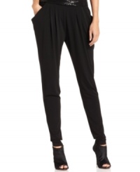 A menswear-inspired pleated front gives these MICHAEL Michael Kors pants elevated appeal. A menswear-inspired pleated front gives these MICHAEL Michael Kors pants elevated appeal.