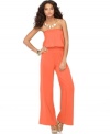 A strapless jumpsuit from Sunny Leigh embodies trend-setting style in a draped silhouette with flowing wide legs. Wear it with chunky sandals for true vintage glamour.