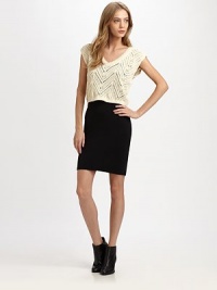 Add romance to any ensemble with this semi-sheer crochet top with a cropped silhouette and v-back detail. Ribbed v-neckCap sleevesRibbed hemV-back detailAbout 17 from shoulder to hemCottonDry cleanImportedModel shown is 5'10 (177cm) wearing US size Small. Add romance to any ensemble with this semi-sheer crochet top with a cropped silhouette and v-back detail. Ribbed v-neckCap sleevesRibbed hemV-back detailAbout 17 from shoulder to hemCottonDry cleanImportedModel shown is 5'10 (177cm) wearing US size Small.