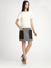 Loose-fitting and crisply tailored, anchored by a striped denim skirt and bold leather patch pockets.Jewel necklineShort sleevesLeather patch pocketsBack keyhole button closureAbout 23 from natural waistCottonDry cleanImportedModel shown is 5'11 (180cm) wearing US size 4. Loose-fitting and crisply tailored, anchored by a striped denim skirt and bold leather patch pockets.Jewel necklineShort sleevesLeather patch pocketsBack keyhole button closureAbout 23 from natural waistCottonDry cleanImportedModel shown is 5'11 (180cm) wearing US size 4.