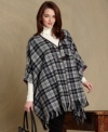 Make a sweeping statement in Tommy Hilfiger's plaid cape. Details like toggle closures and a fringed hem are so stylish, while the wool-blend fabric is so cozy.